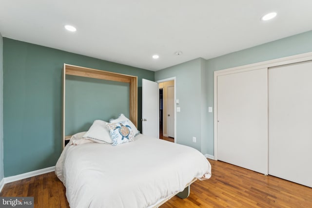 bedroom featuring recessed lighting, baseboards, and wood finished floors