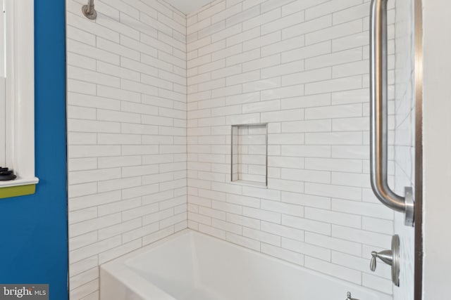 bathroom with washtub / shower combination