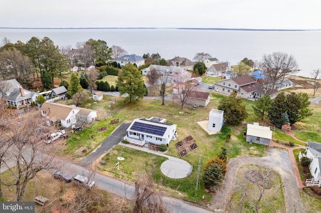 bird's eye view featuring a residential view and a water view