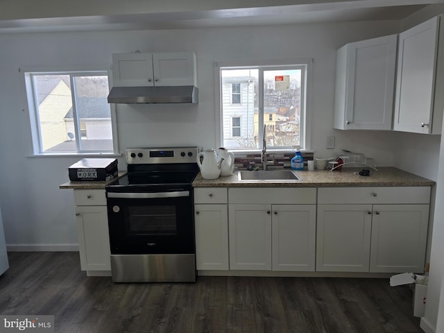 325 W Washington St, Tamaqua, PA 18252 - kitchen featuring stainless steel electric range oven, white cabinets, under cabinet range hood, and a sink