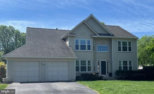 11 Ashbrook Rd, Stafford, VA 22554 - view of front facade with an attached garage, driveway, and a front yard
