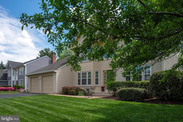 11 Ashbrook Rd, Stafford, VA 22554 - view of front facade with a garage, driveway, and a front lawn