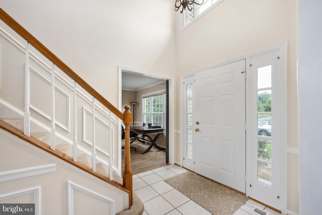 11 Ashbrook Rd, Stafford, VA 22554 - entryway featuring stairs, light tile patterned flooring, a high ceiling, ornamental molding, and baseboards