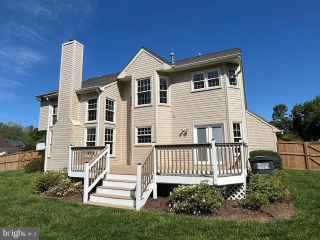 11 Ashbrook Rd, Stafford, VA 22554 - back of property with a chimney and a deck