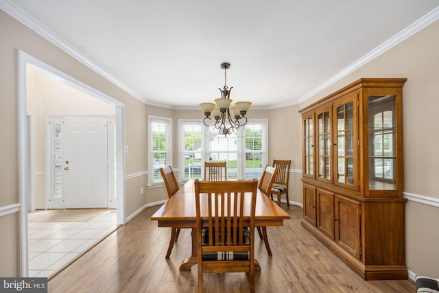 11 Ashbrook Rd, Stafford, VA 22554 - dining area with a chandelier, light wood-type flooring, crown molding, baseboards, and a baseboard heating unit