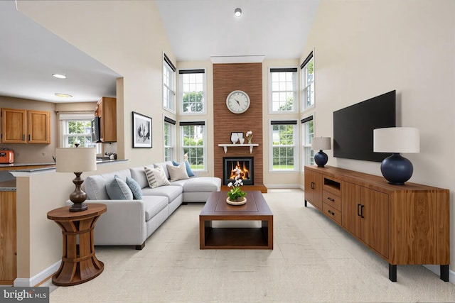 11 Ashbrook Rd, Stafford, VA 22554 - living area featuring a high ceiling, plenty of natural light, baseboards, a brick fireplace, and recessed lighting