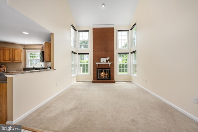 11 Ashbrook Rd, Stafford, VA 22554 - unfurnished living room with baseboards, a high ceiling, light carpet, and recessed lighting