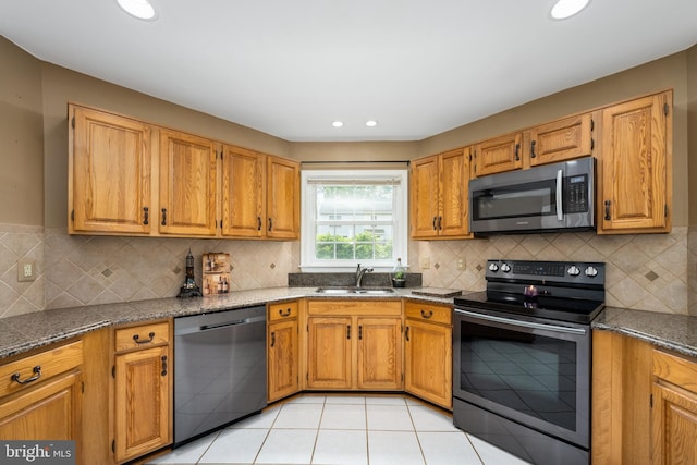 11 Ashbrook Rd, Stafford, VA 22554 - kitchen with appliances with stainless steel finishes, a sink, dark stone countertops, backsplash, and recessed lighting