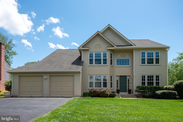 11 Ashbrook Rd, Stafford, VA 22554 - view of front of home featuring a garage, asphalt driveway, a front lawn, and a shingled roof