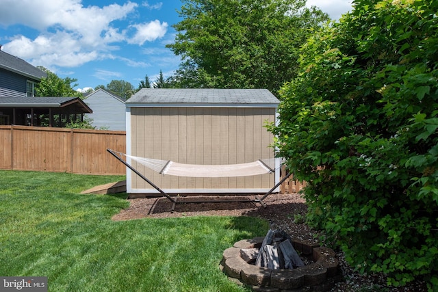 11 Ashbrook Rd, Stafford, VA 22554 - view of yard featuring a shed, an outdoor fire pit, and an outbuilding