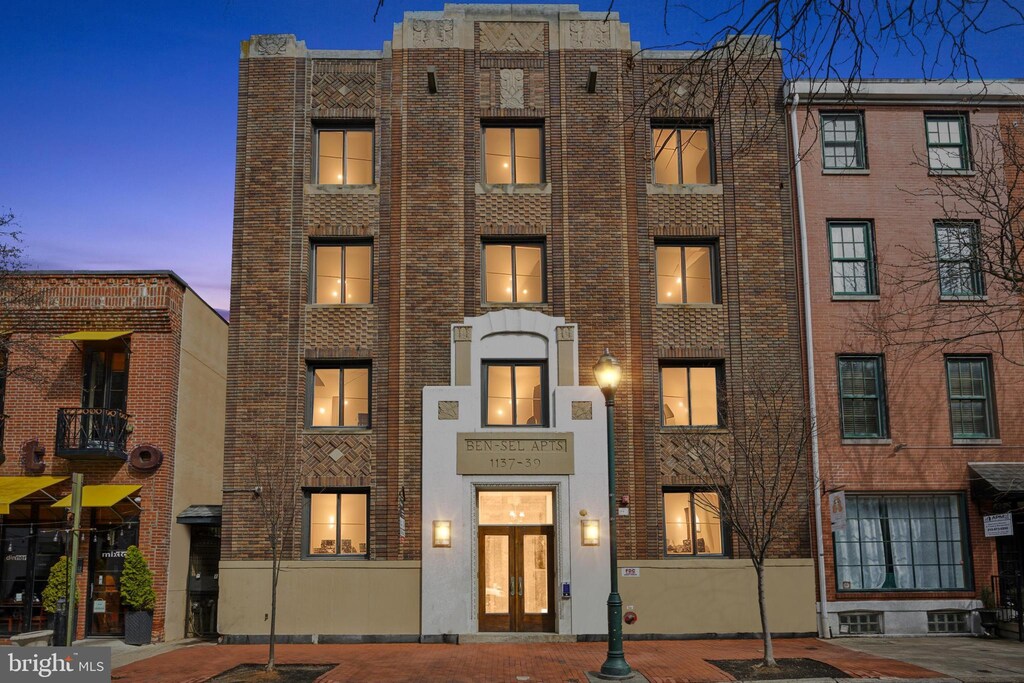 view of property with brick siding