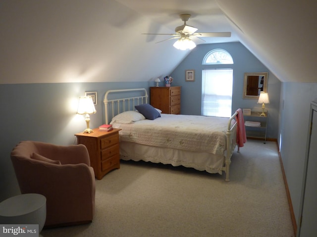 bedroom with ceiling fan, lofted ceiling, carpet flooring, and baseboards