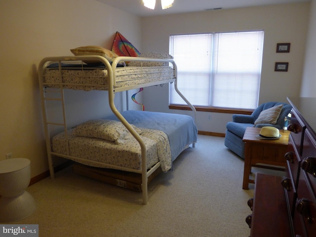 carpeted bedroom with baseboards