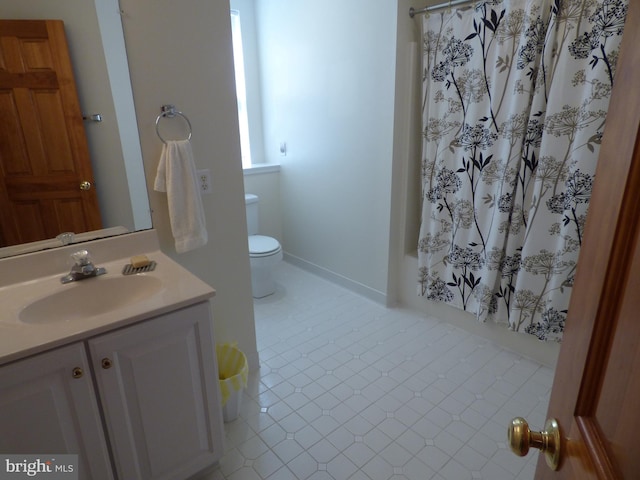 full bath featuring tile patterned floors, toilet, curtained shower, and vanity