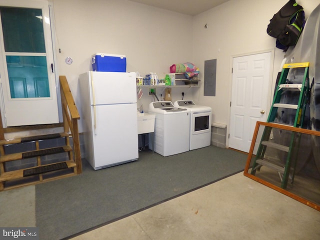 laundry room with separate washer and dryer and electric panel