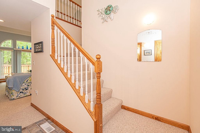 staircase featuring carpet flooring, visible vents, baseboards, and recessed lighting