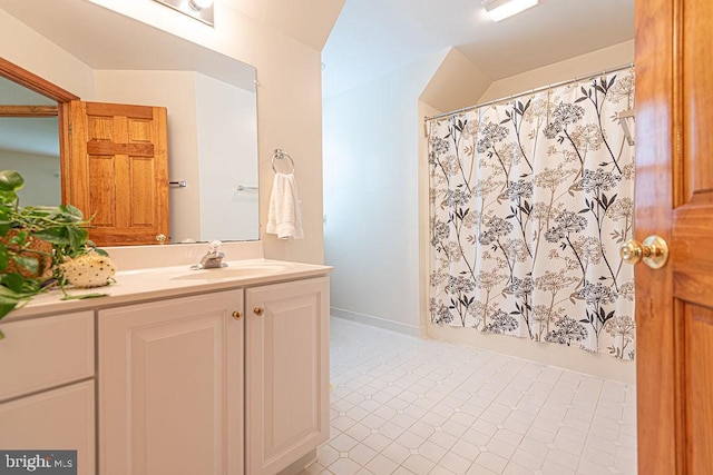 full bathroom with vanity, a shower with curtain, and tile patterned floors