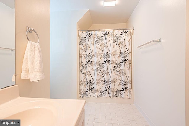 full bath featuring vanity and curtained shower