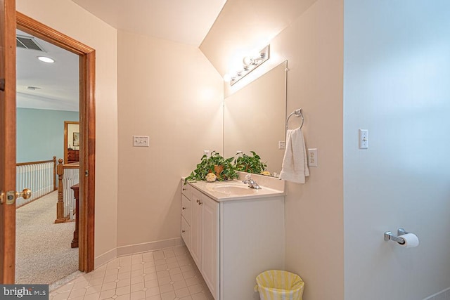 bathroom with baseboards, recessed lighting, vanity, and visible vents