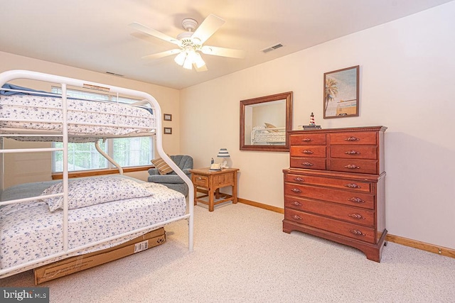 bedroom with light carpet, baseboards, a ceiling fan, and visible vents