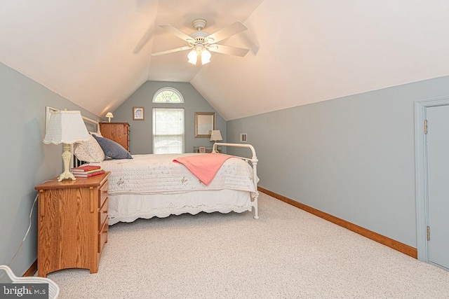 bedroom with baseboards, lofted ceiling, ceiling fan, and carpet floors
