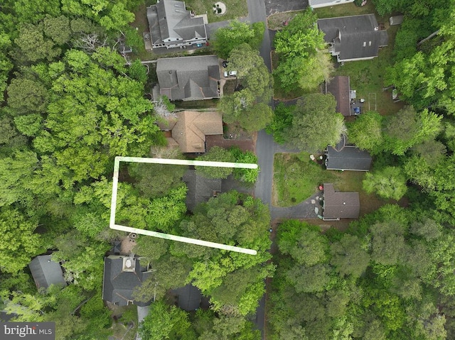 birds eye view of property with a residential view