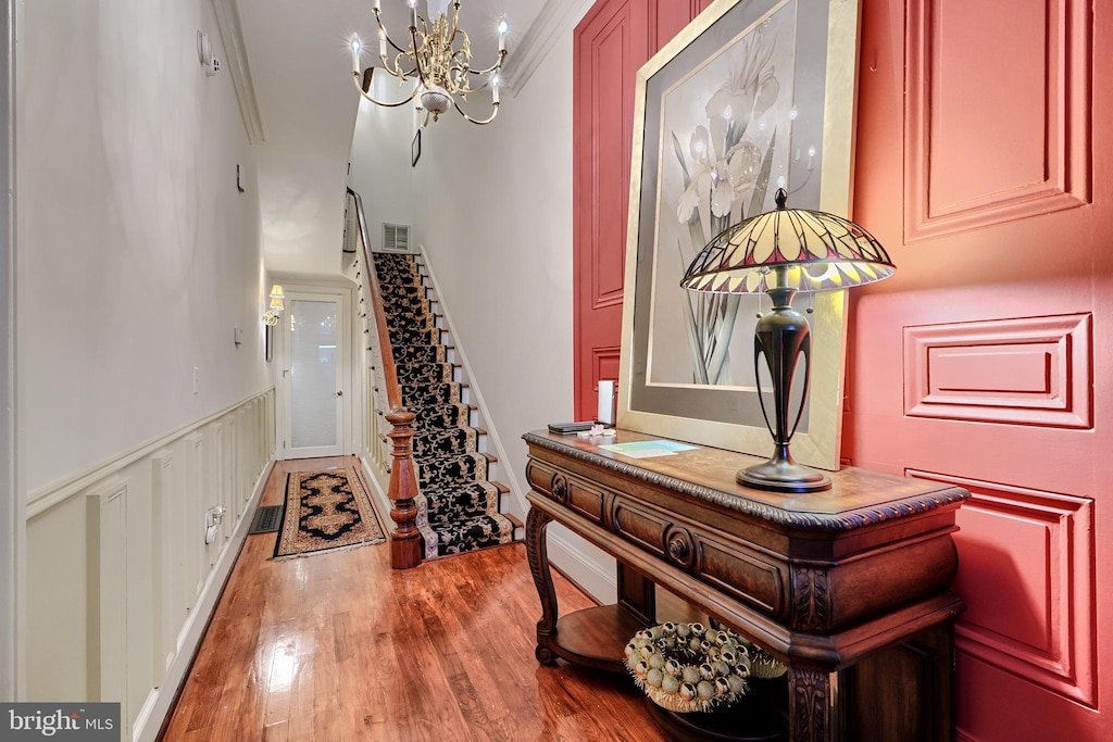 1404 Park Ave, Baltimore, MD 21217 - entryway featuring wood finished floors, a chandelier, and stairway