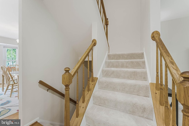 stairway featuring baseboards
