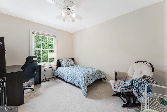 carpeted bedroom with a ceiling fan