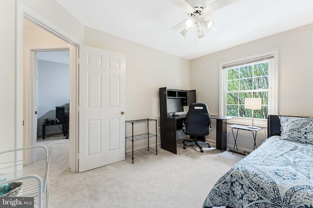 bedroom with ceiling fan, baseboards, and carpet floors