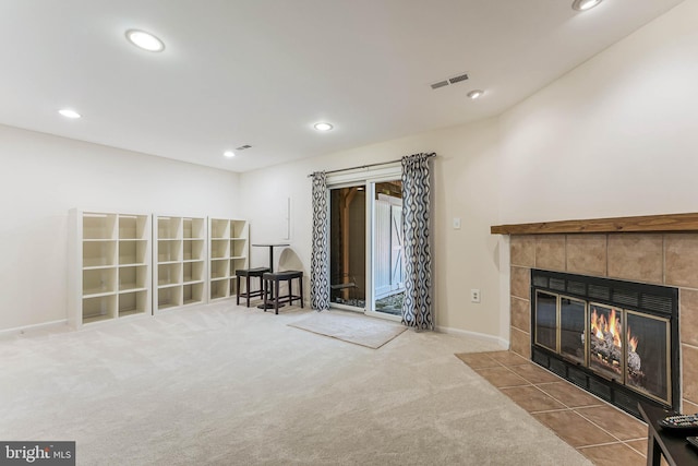 sitting room featuring recessed lighting, a tile fireplace, visible vents, carpet, and baseboards