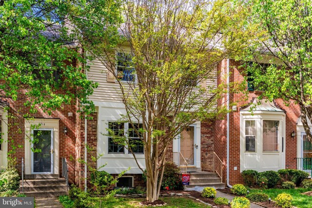 townhome / multi-family property with brick siding