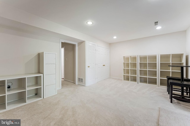 unfurnished room with carpet, visible vents, recessed lighting, and baseboards