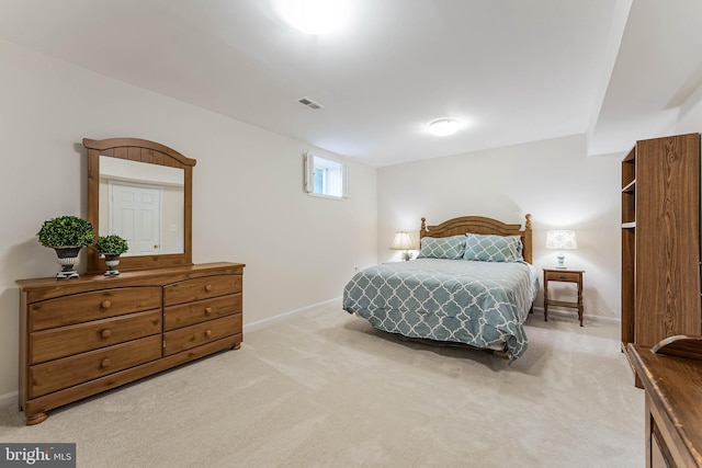 bedroom featuring visible vents, carpet flooring, and baseboards