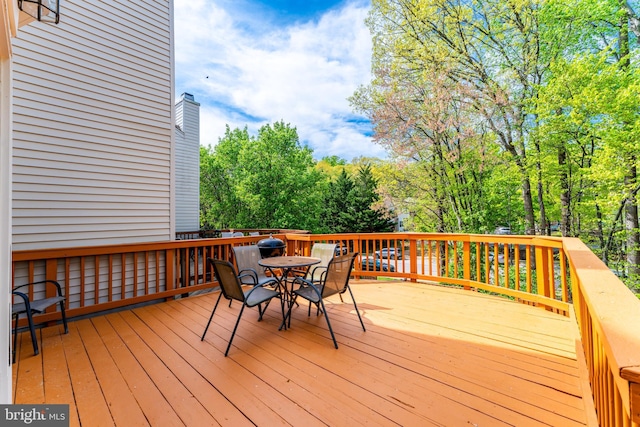 wooden deck featuring outdoor dining space
