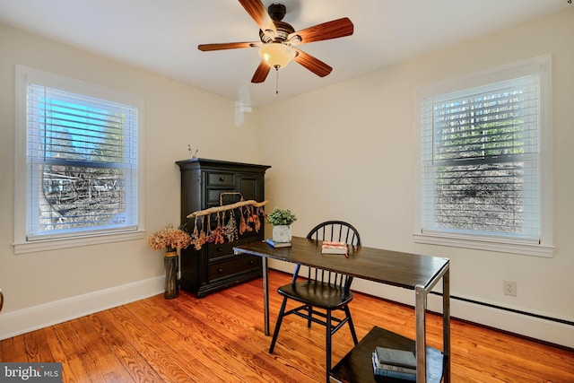 office with light wood-type flooring, baseboards, and ceiling fan