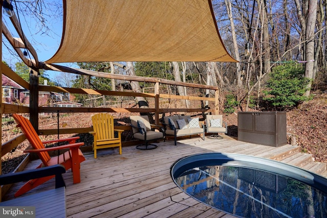 deck with a hot tub