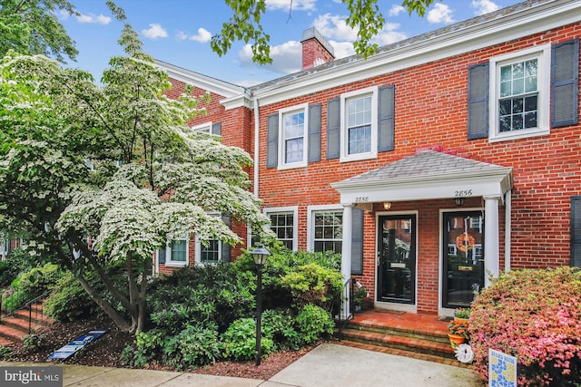 2858 S Abingdon St, Arlington, VA 22206 - view of front of property featuring brick siding and a chimney