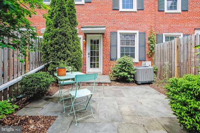 2858 S Abingdon St, Arlington, VA 22206 - view of patio featuring central AC unit, fence, and outdoor dining space