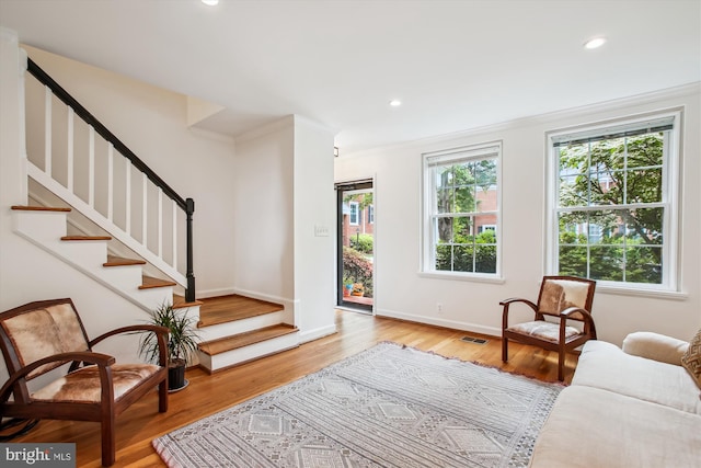 2858 S Abingdon St, Arlington, VA 22206 - living area with crown molding, stairs, light wood-type flooring, recessed lighting, and baseboards