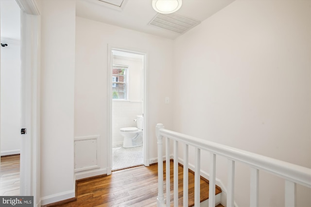 2858 S Abingdon St, Arlington, VA 22206 - hallway featuring wood-type flooring and an upstairs landing