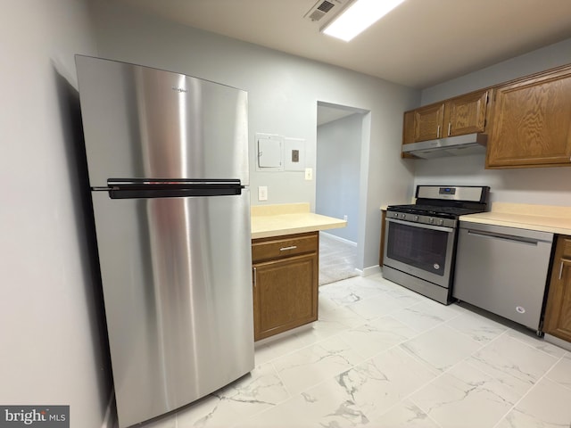 1415 Northgate Sq Unit 15/21B, Reston, VA 20190 - kitchen with visible vents, under cabinet range hood, light countertops, marble finish floor, and stainless steel appliances