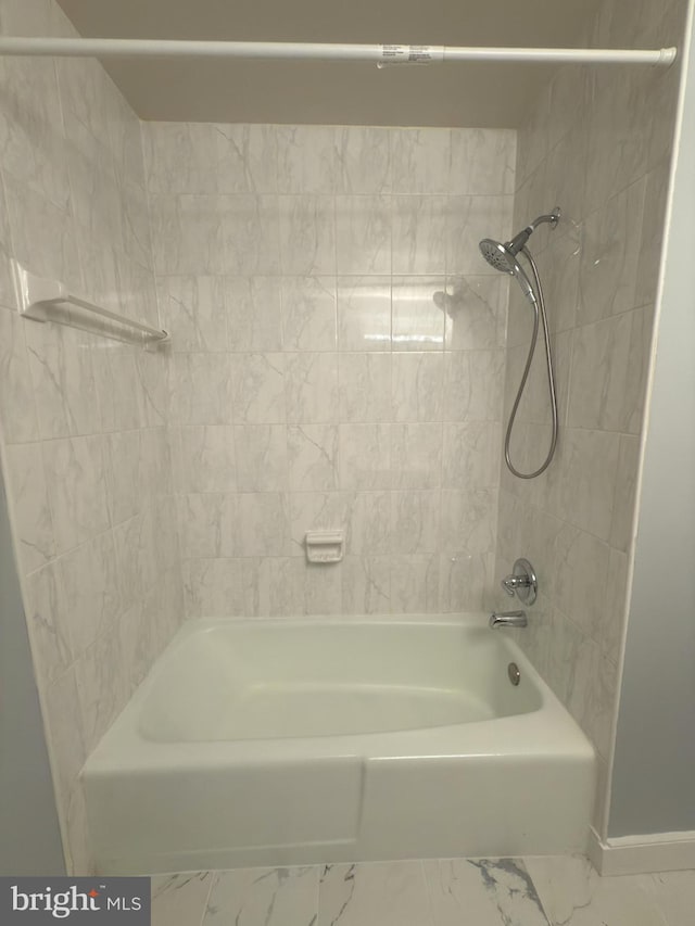 1415 Northgate Sq Unit 15/21B, Reston, VA 20190 - bathroom featuring shower / bath combination, baseboards, and marble finish floor