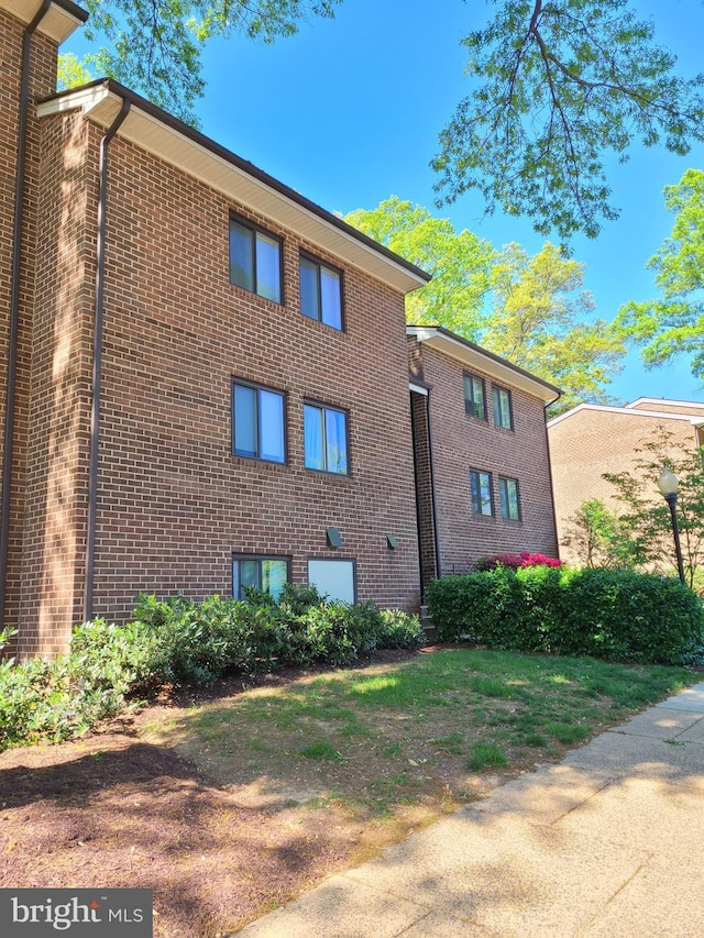 1415 Northgate Sq Unit 15/21B, Reston, VA 20190 - view of property exterior featuring brick siding
