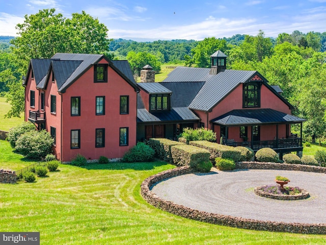 9425 Blackpond Ln, Delaplane, VA 20144 - view of front of home featuring a standing seam roof, metal roof, a front lawn, and curved driveway