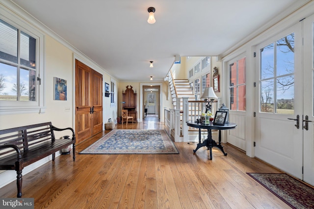 9425 Blackpond Ln, Delaplane, VA 20144 - entryway featuring hardwood / wood-style floors, stairway, and ornamental molding