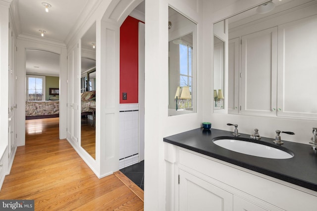 9425 Blackpond Ln, Delaplane, VA 20144 - bathroom with wood finished floors, vanity, and ornamental molding