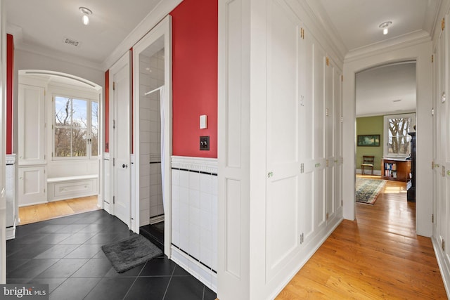 9425 Blackpond Ln, Delaplane, VA 20144 - corridor with arched walkways, ornamental molding, tile patterned flooring, and wainscoting