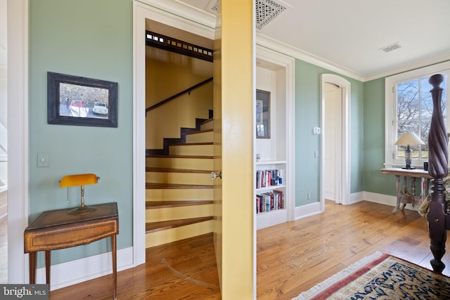 9425 Blackpond Ln, Delaplane, VA 20144 - stairs with wood finished floors, baseboards, and crown molding