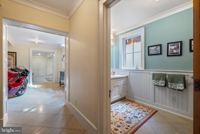 9425 Blackpond Ln, Delaplane, VA 20144 - hall featuring ornamental molding, light tile patterned flooring, and a wainscoted wall